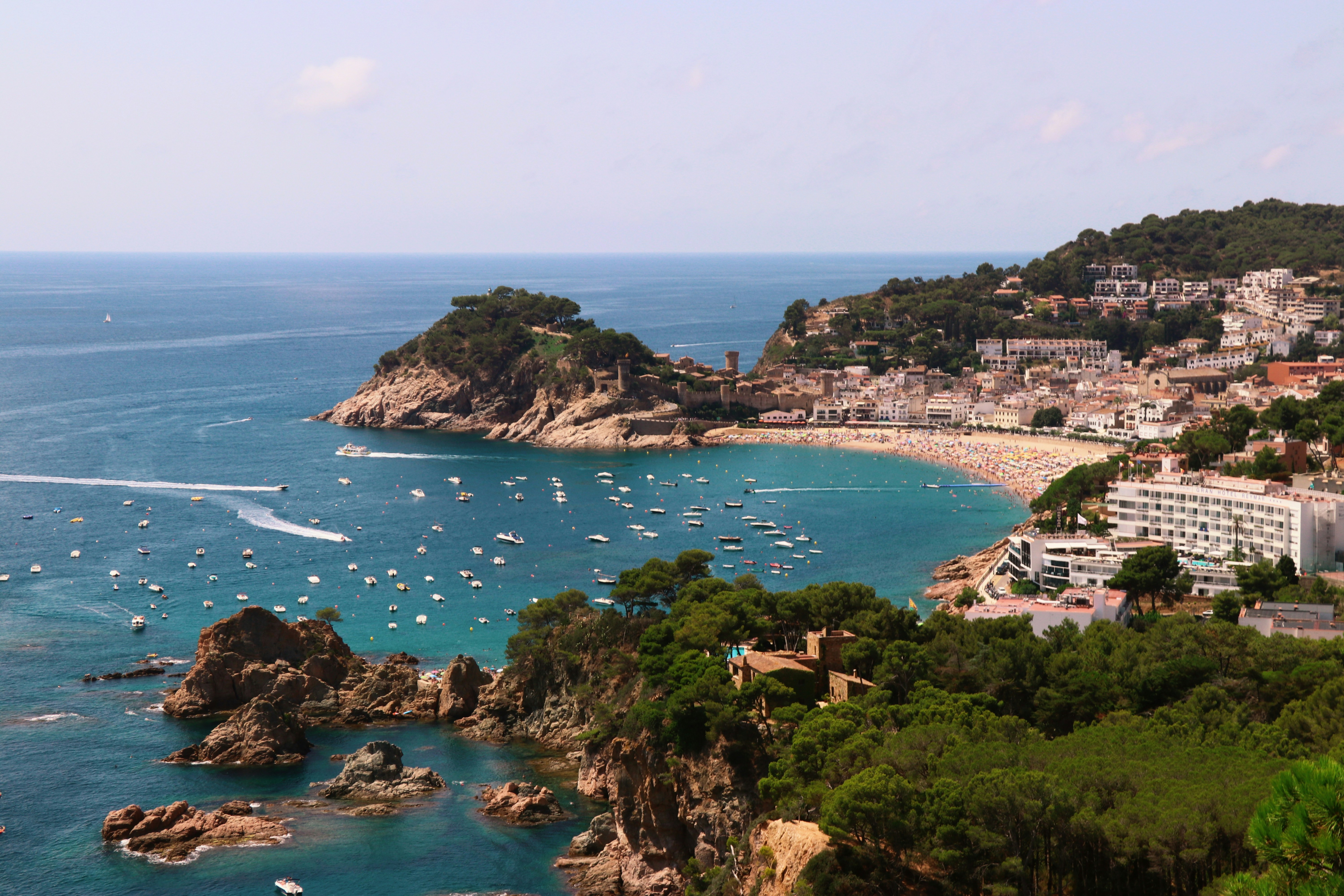 a view of a beach with boats in the water