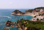 a view of a beach with boats in the water
