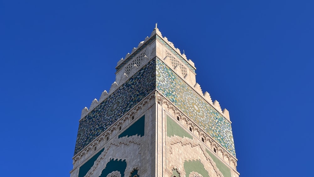 a tall tower with a blue sky in the background