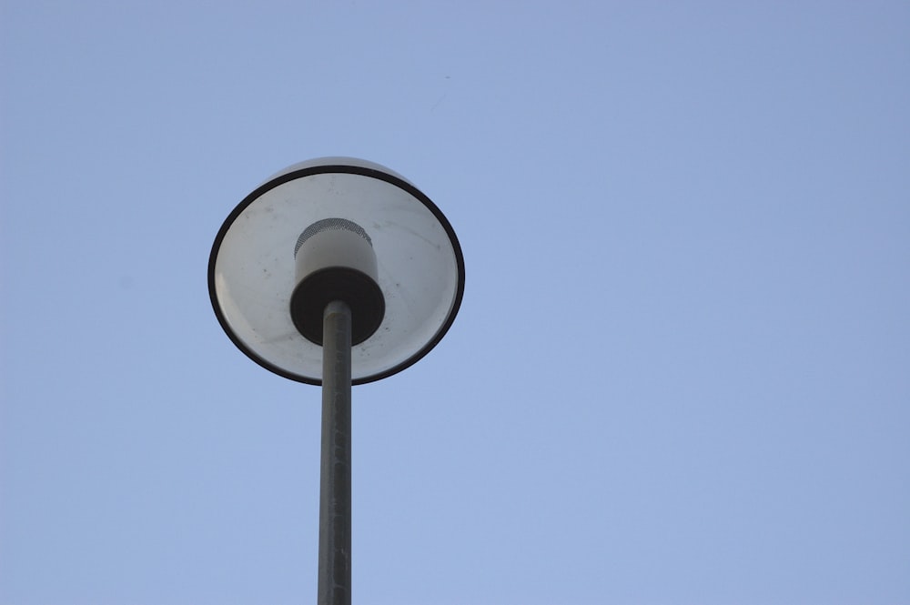 a street light with a clear blue sky in the background