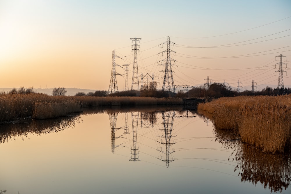 a body of water surrounded by power lines