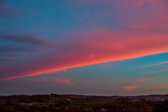 A scenic landscape at sunset with dreamy pastel colors.