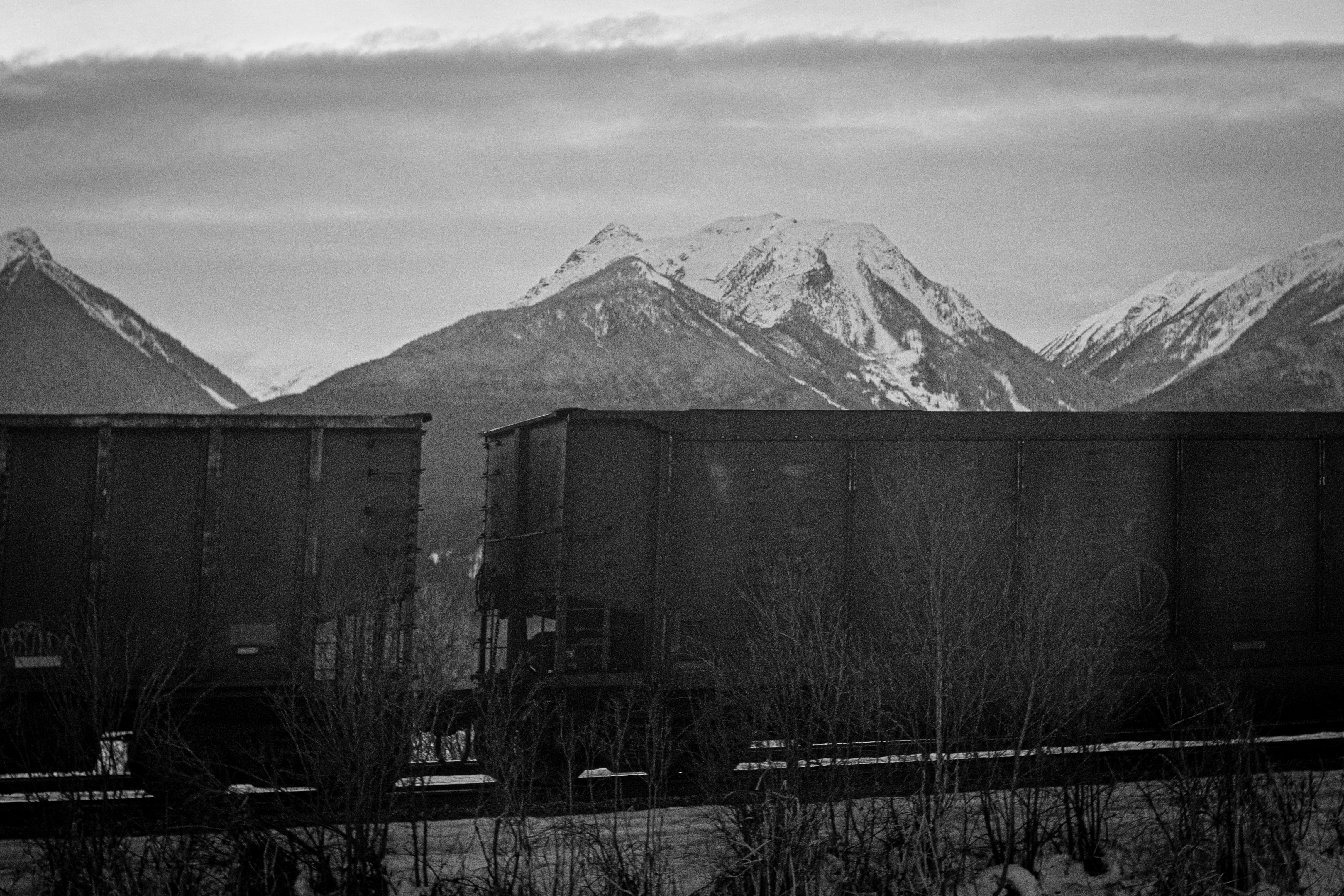 a black and white photo of a mountain range