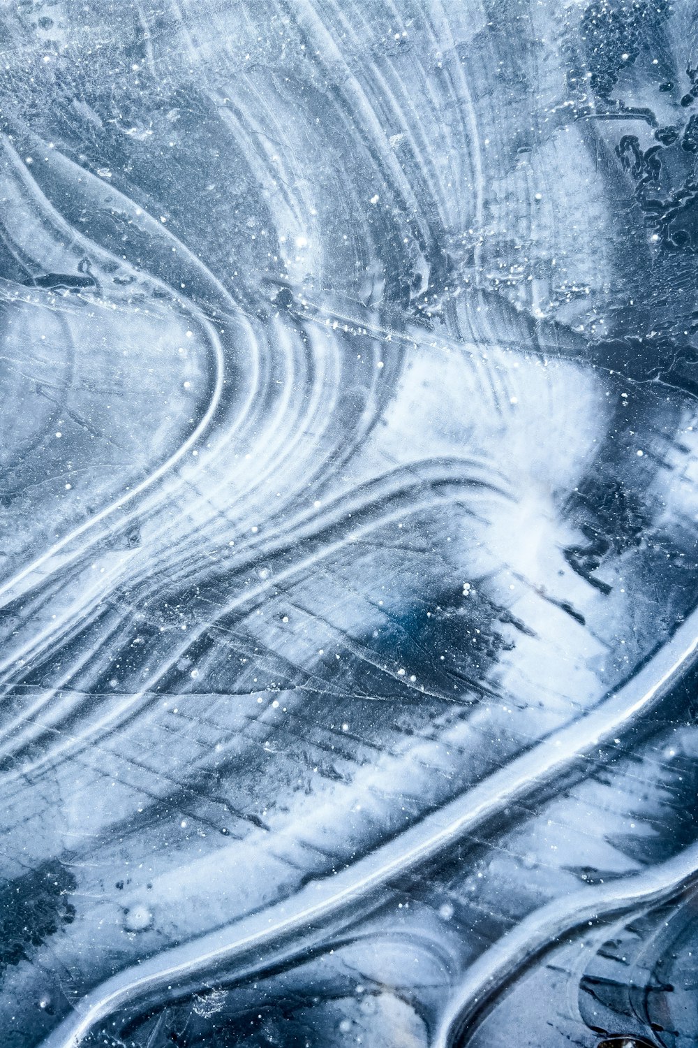 an aerial view of a road in the snow