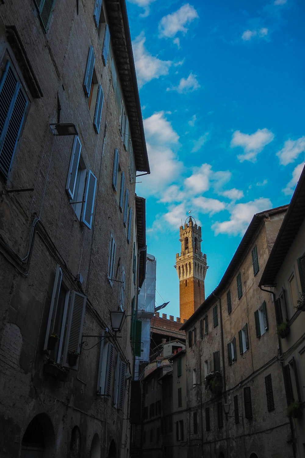 a tall clock tower towering over a city