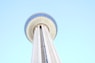 a tall white tower with a sky background