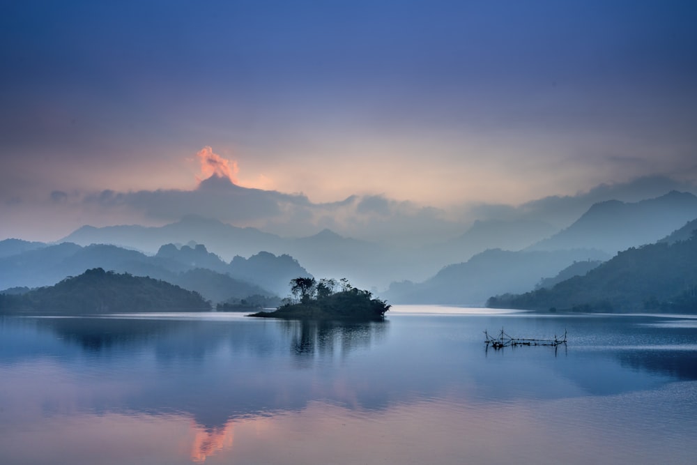 a body of water with a small island in the middle of it