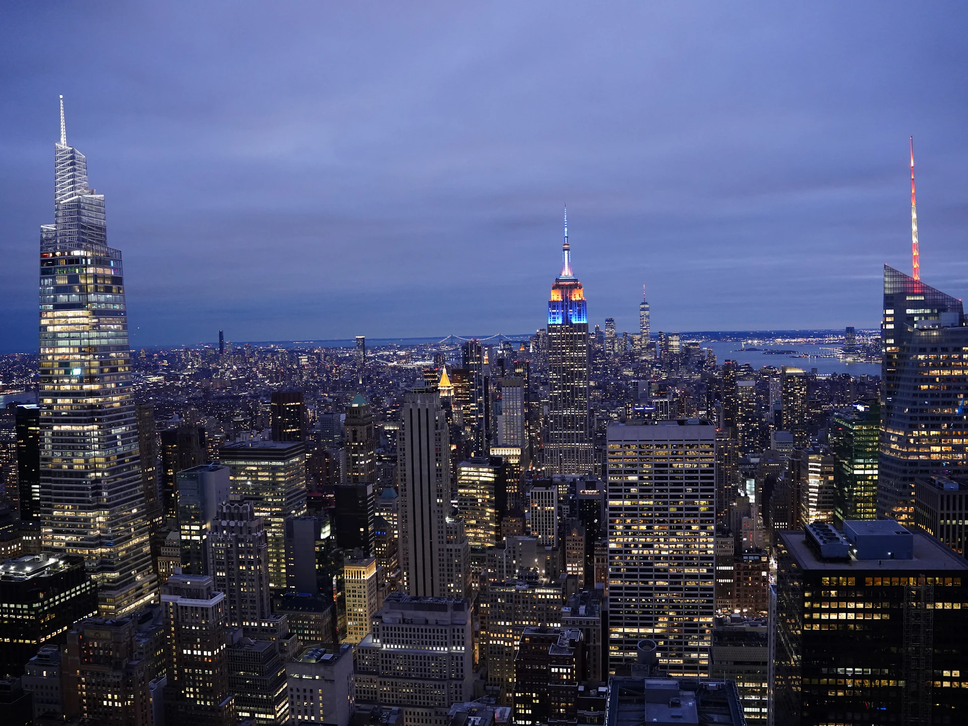 a view of a city at night from the top of a building