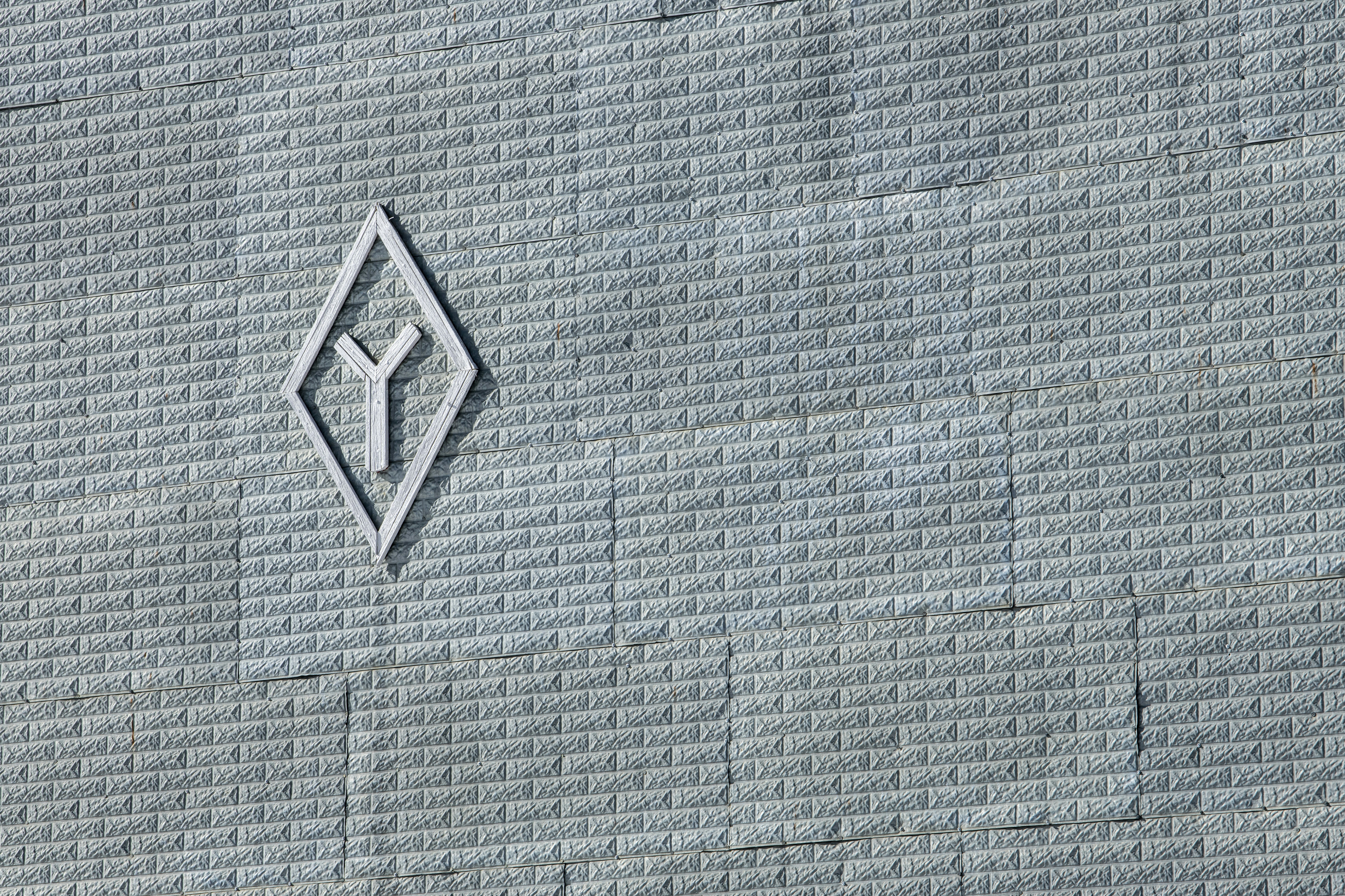 a close up of a wall with a logo on it