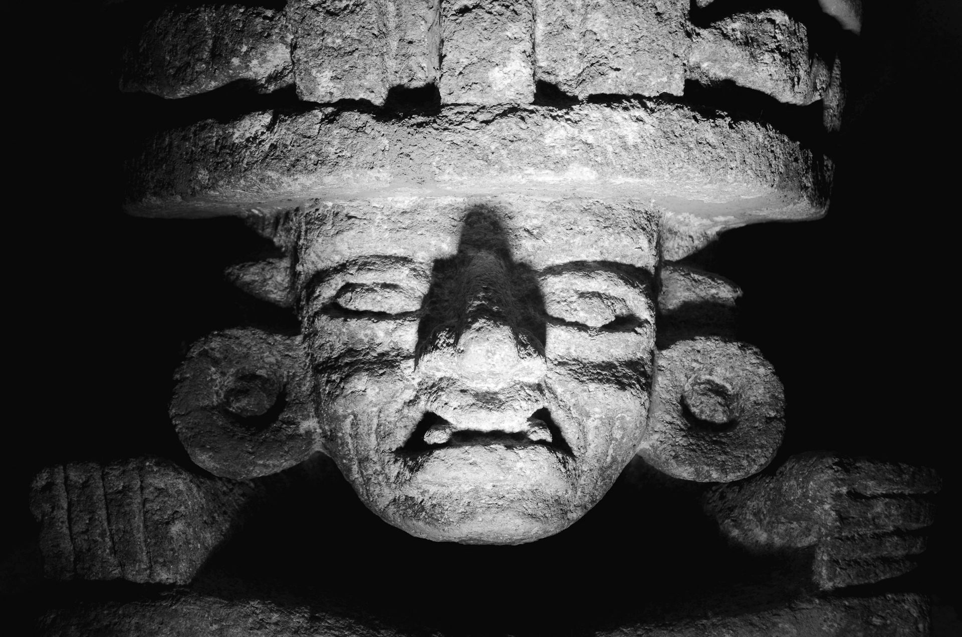 a black and white photo of a statue