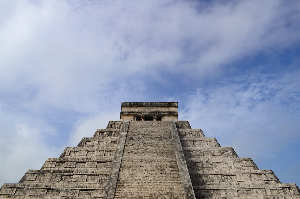 a very tall pyramid with a sky in the background