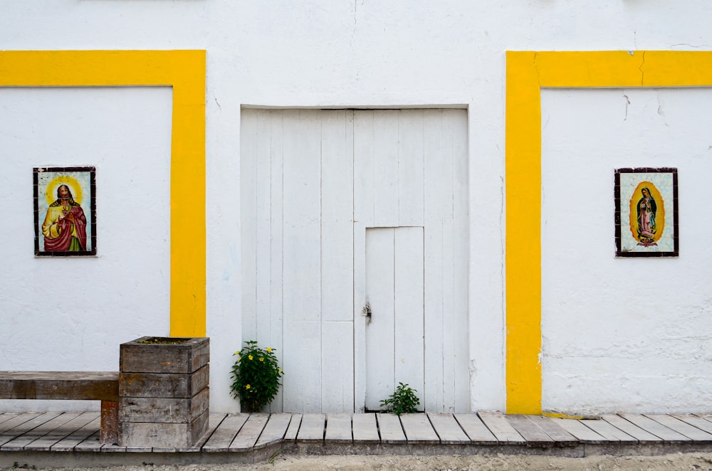 a yellow and white building with a white door