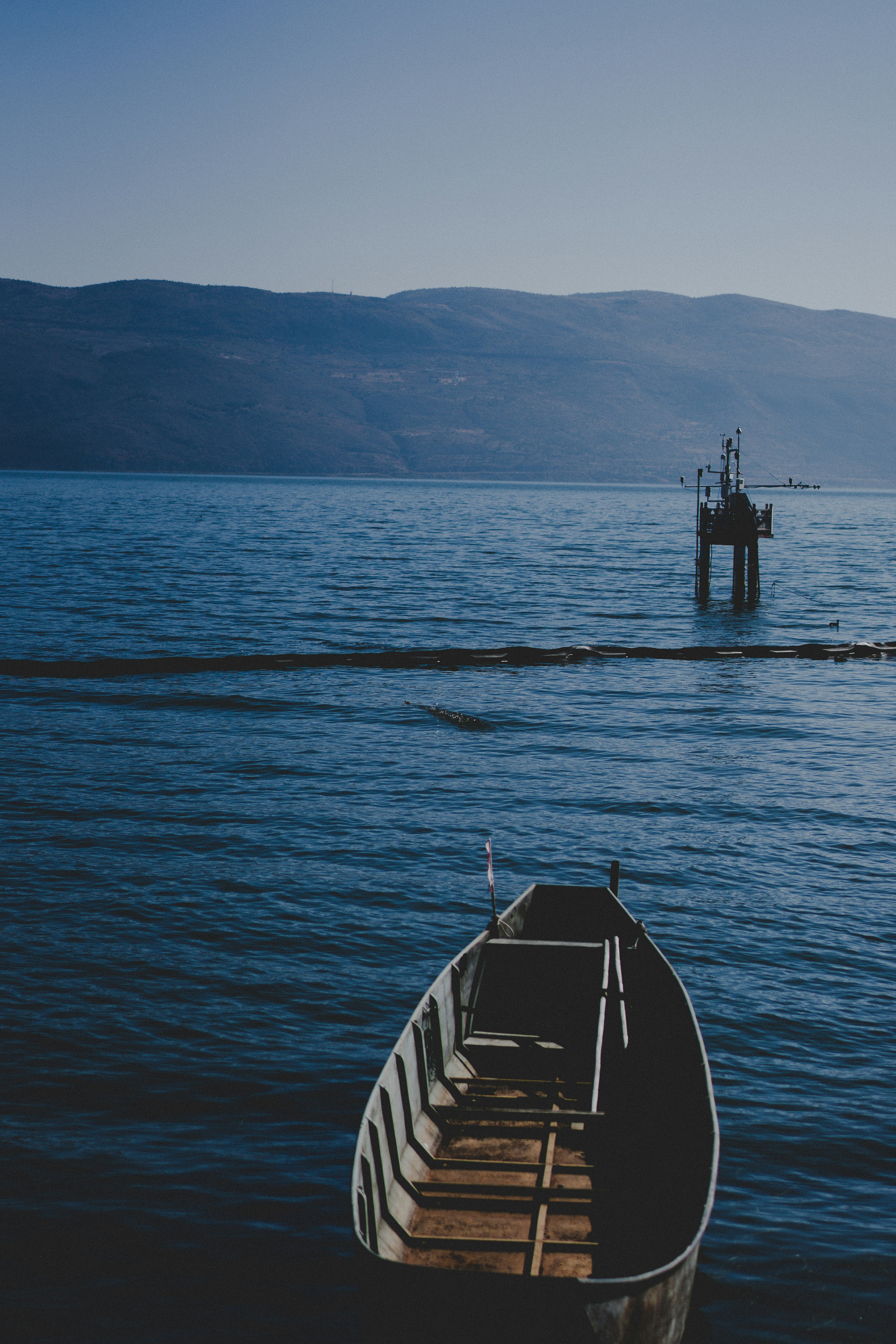 a boat sitting on top of a body of water
