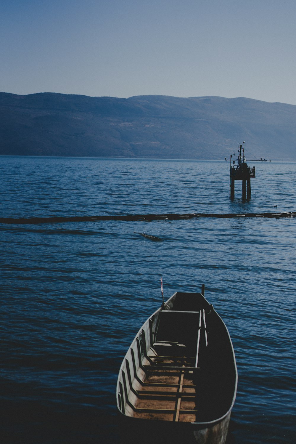 a boat sitting on top of a body of water