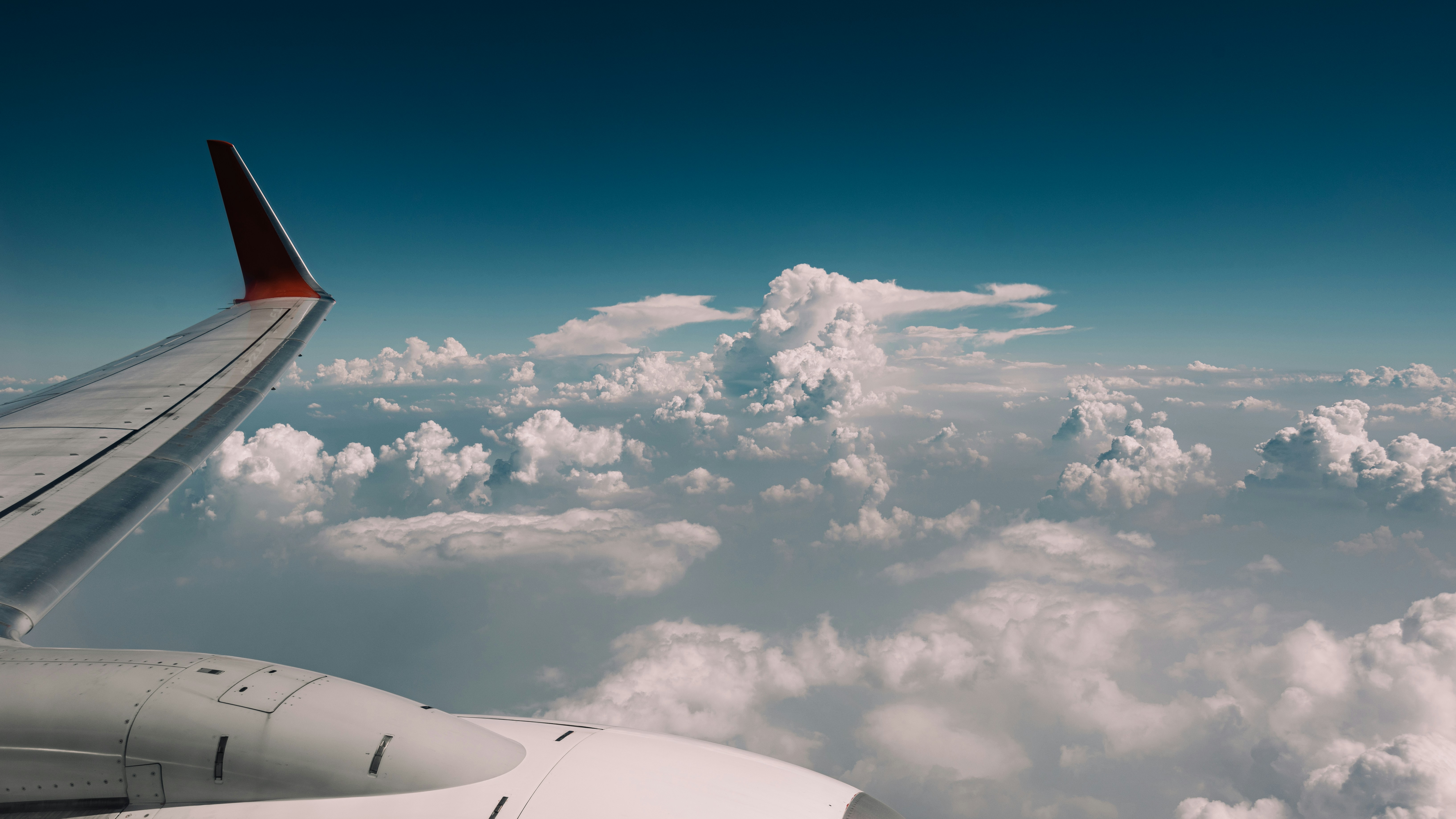 Airplane wing above clouds