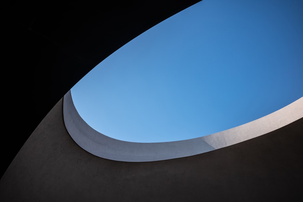a blue sky seen through a circular window