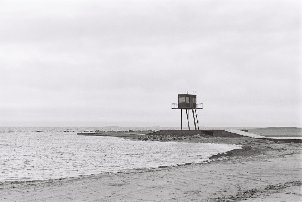 a black and white photo of a water tower