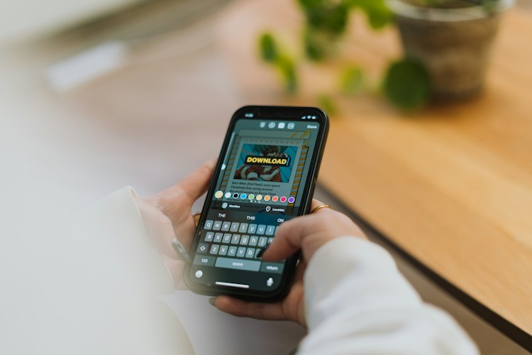 Person creating an Instagram Story with captions on their phone