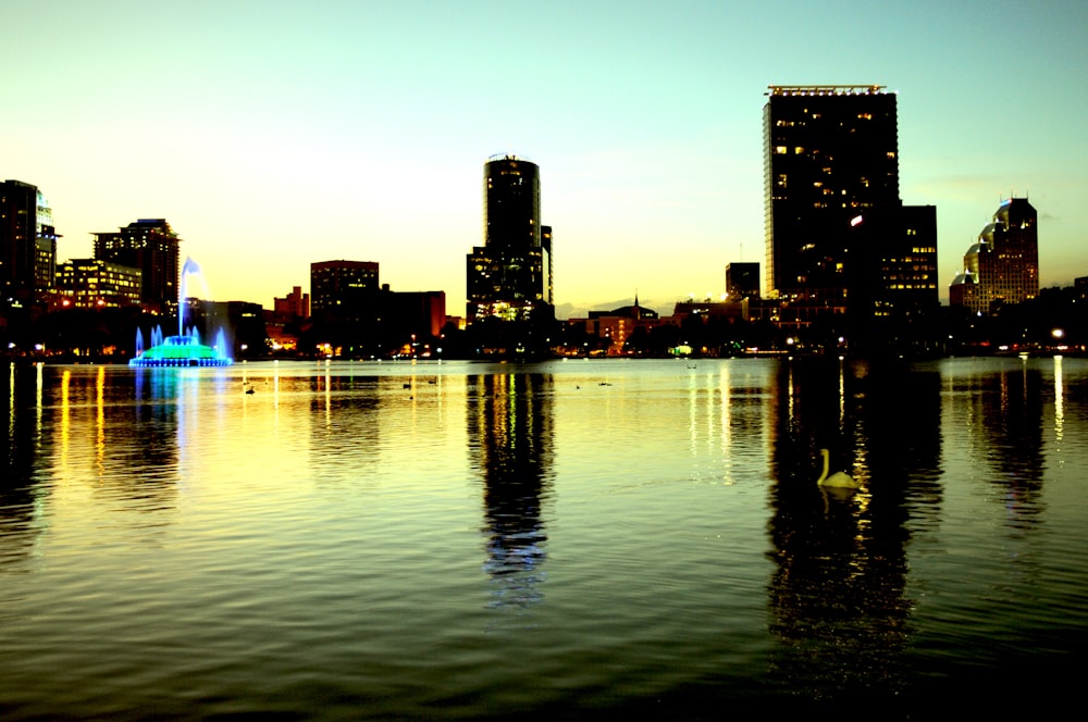 a view of a city at night from across a lake