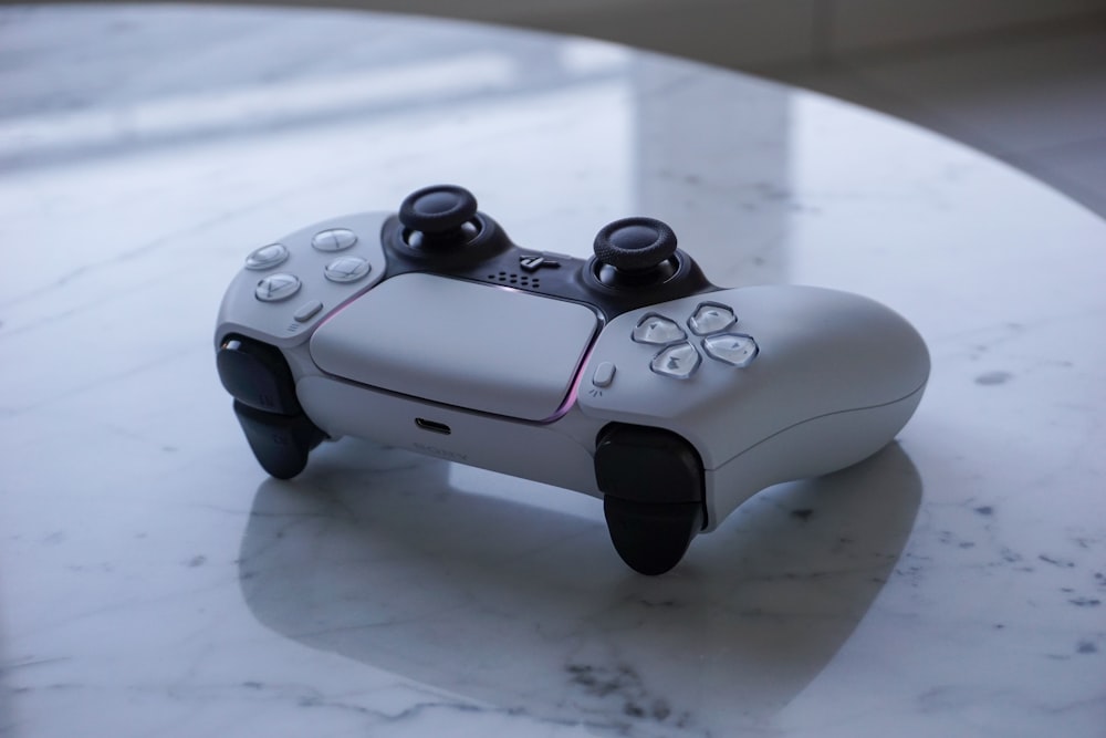 a close up of a game controller on a table