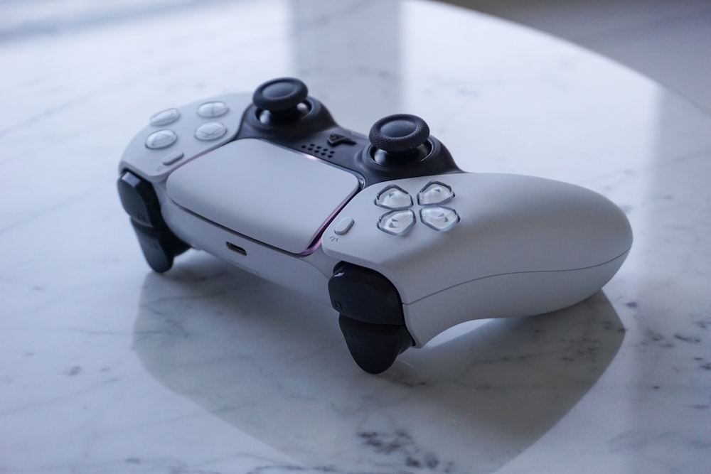 a close up of a game controller on a table