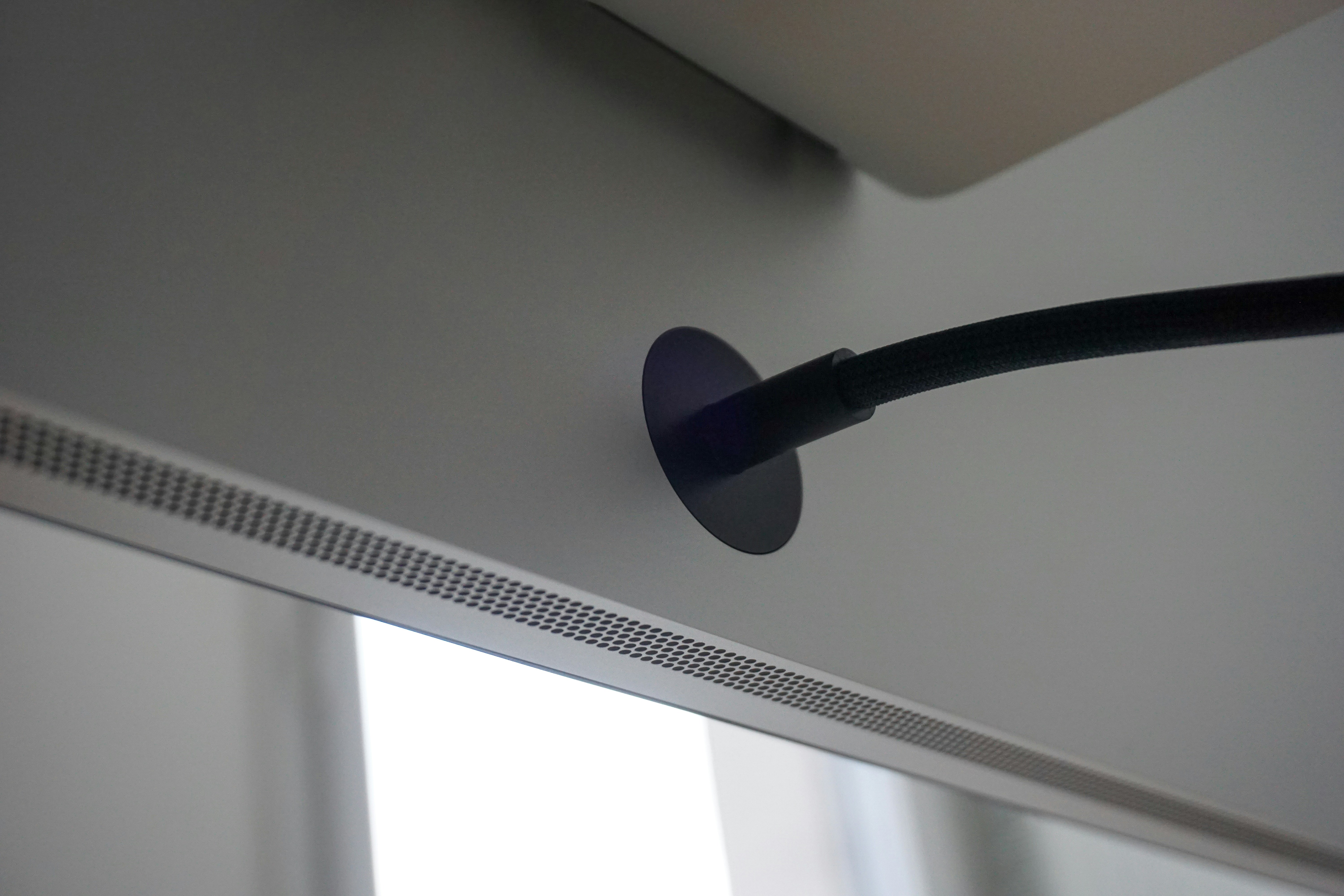 low profile smart home camera sensor mounted beneath television bezel