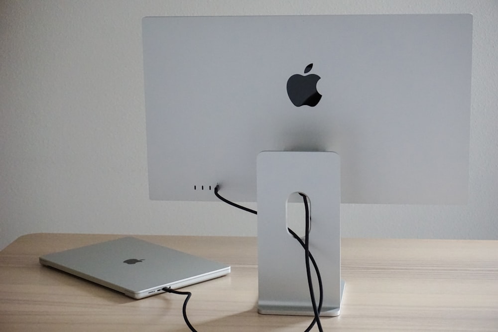an apple computer is plugged into a charger