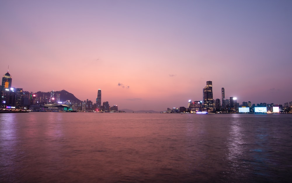 a large body of water with a city in the background