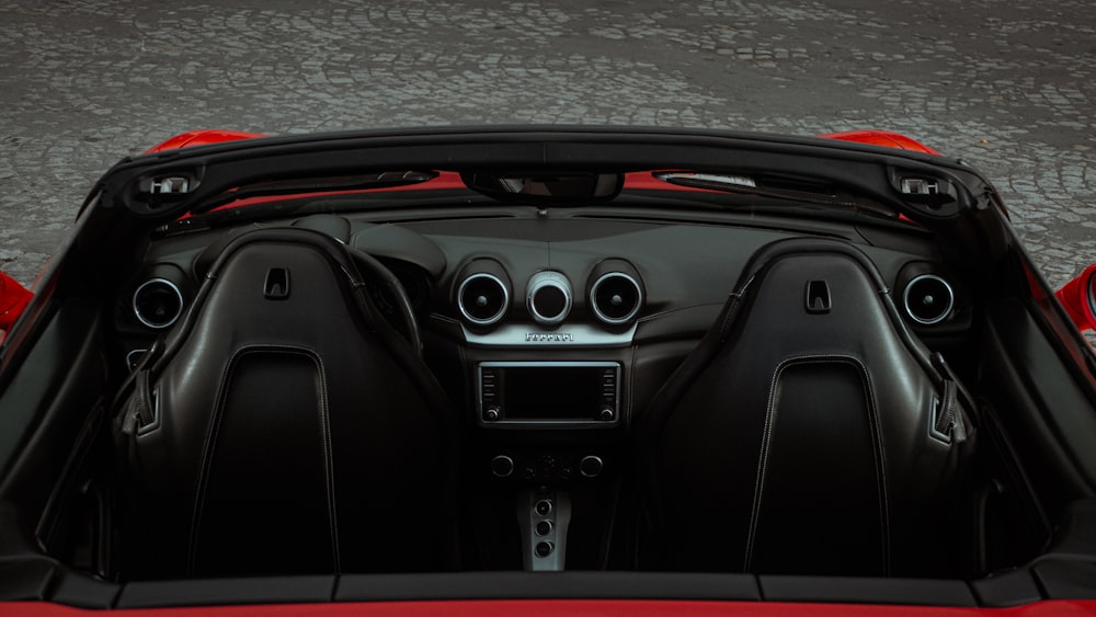 the interior of a red sports car