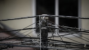 a close up of wires and wires on a pole