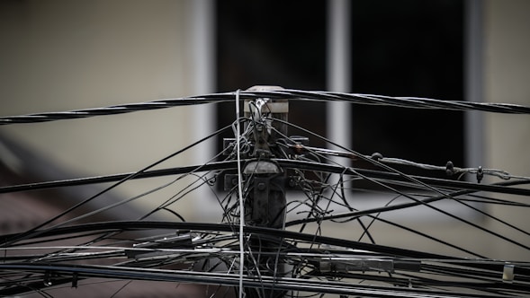 a close up of wires and wires on a pole