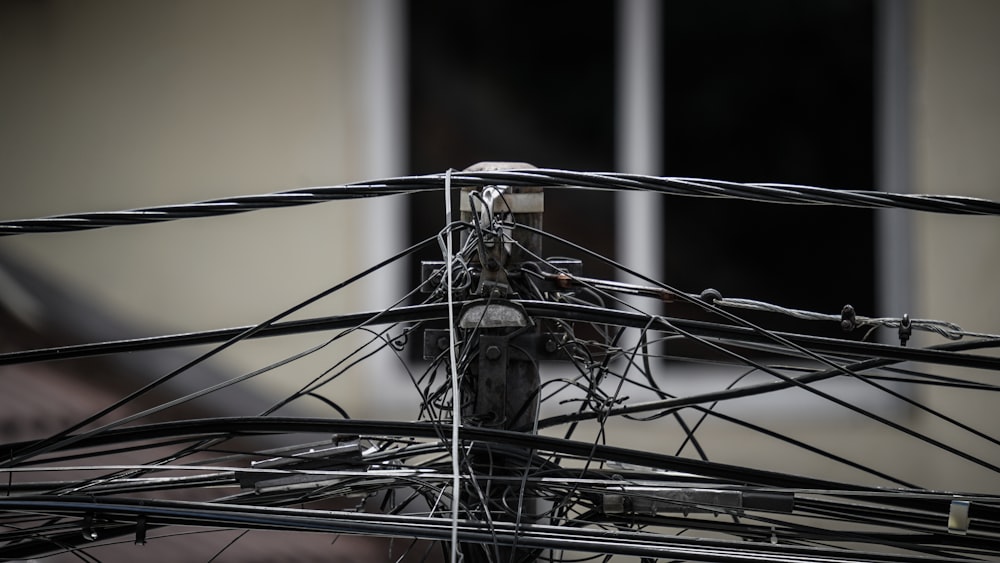 a close up of wires and wires on a pole