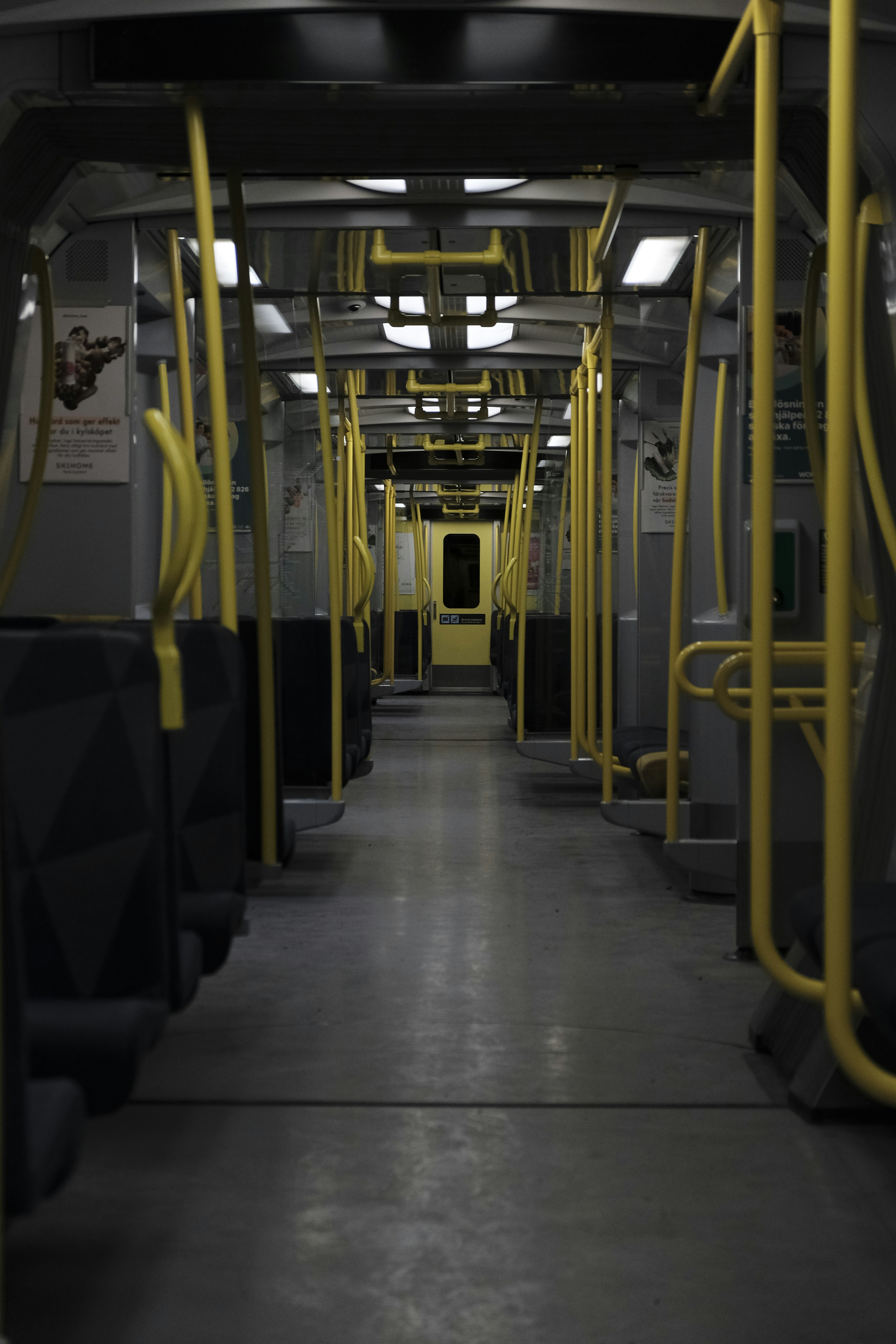A subway car with yellow railings and seats photo – Free Wallpaper ...