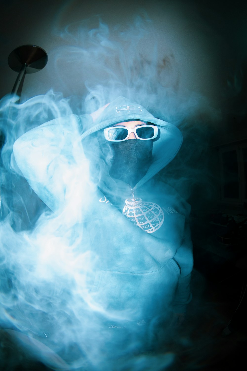a person in a white suit with a hood and goggles