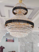 Professional fitter adjusting elegant curtains in a modern Saudi living room