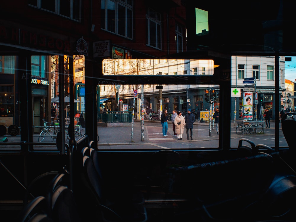 a view of a city street from inside a bus