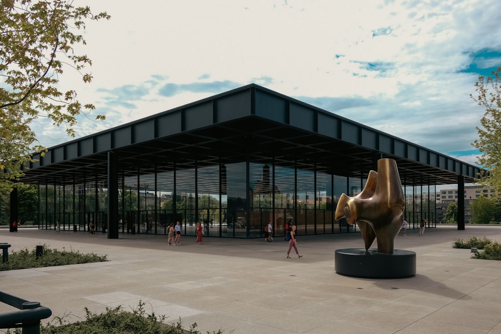 a sculpture of a dog in front of a building