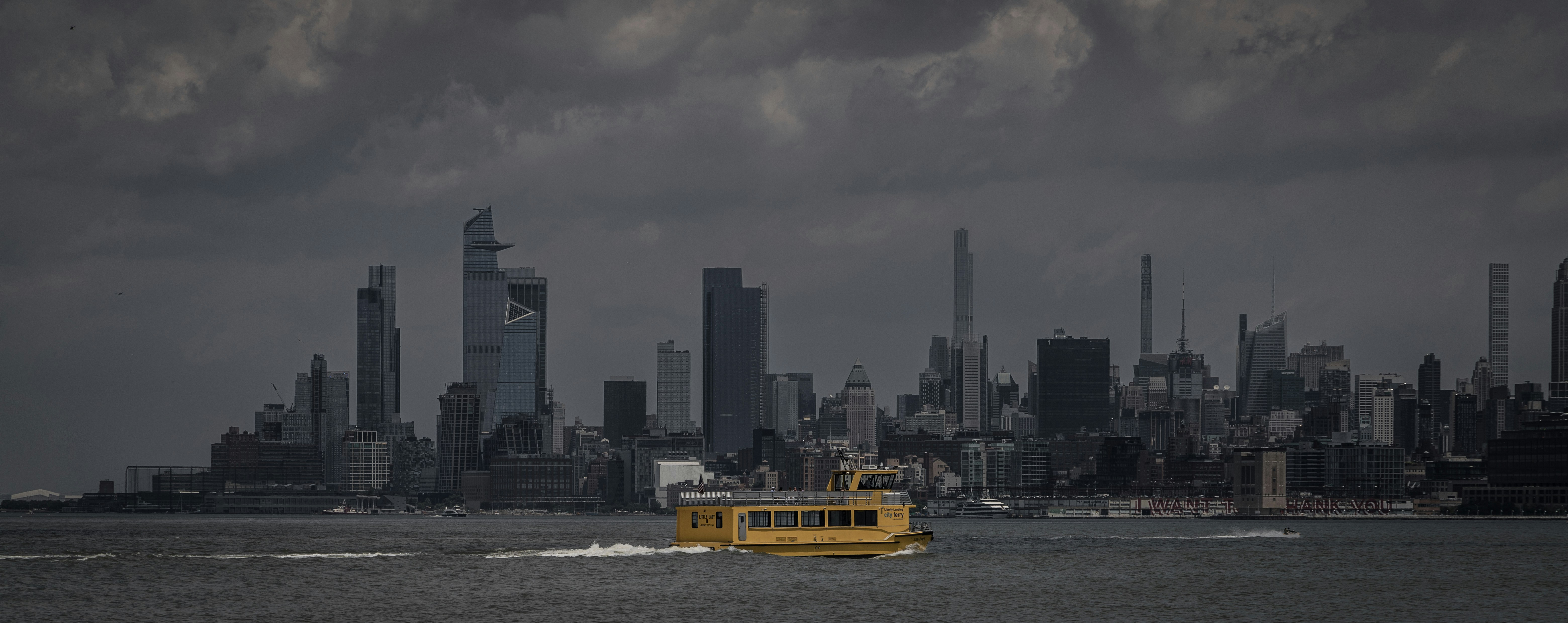 a yellow boat in a large body of water