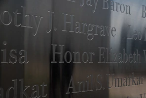 Custom name plate with bold lettering embedded in clear glossy resin