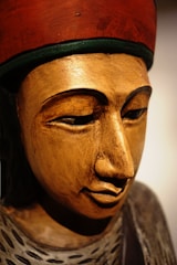 A close-up of a finely carved wooden sculpture capturing the essence of African heritage.