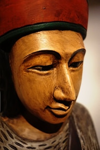 A close-up of a finely carved wooden sculpture capturing the essence of African heritage.