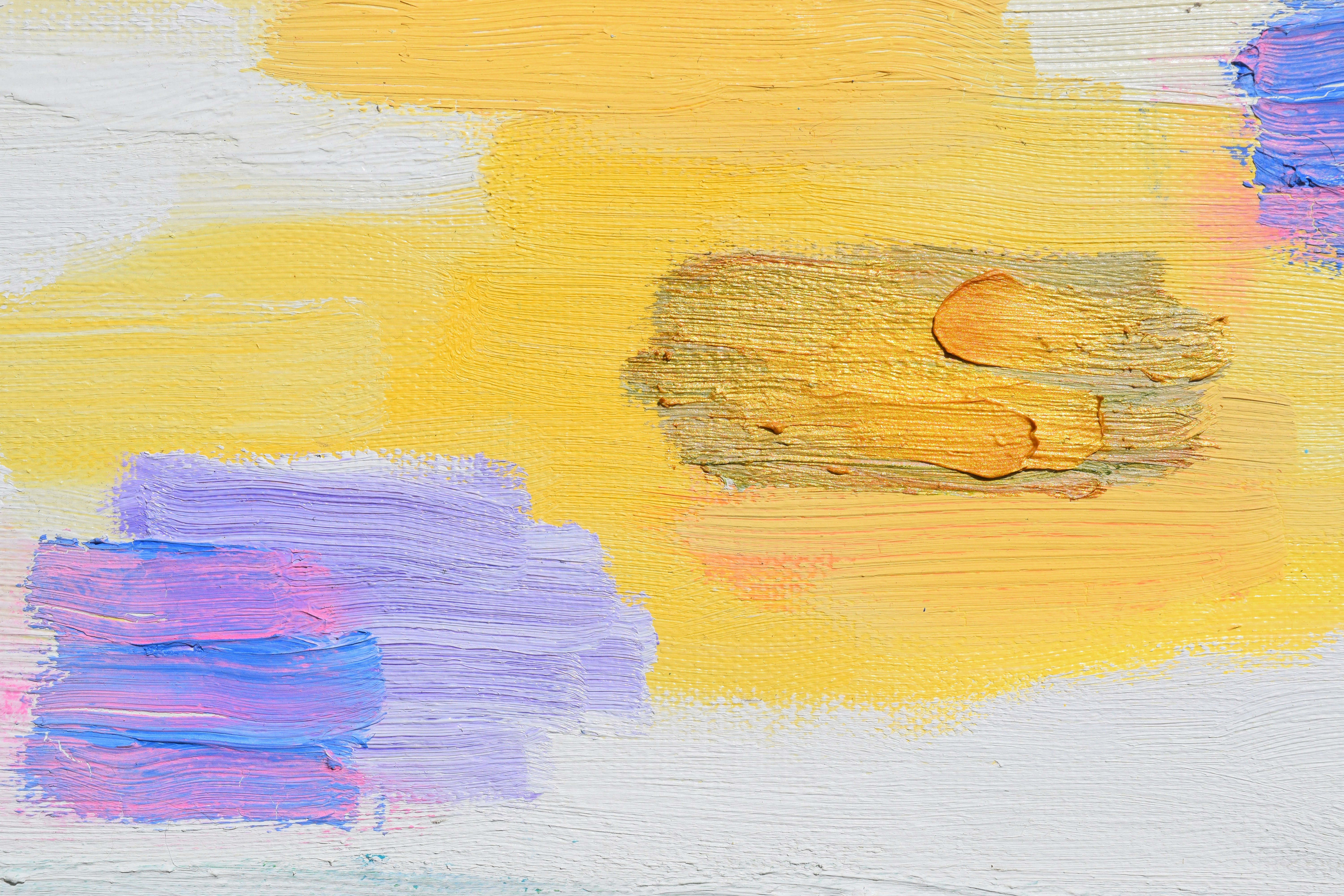 close-up of a yellow and purple abstract painting
