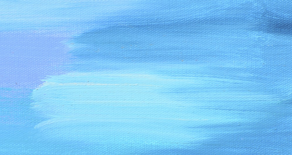 a painting of a blue sky with white clouds