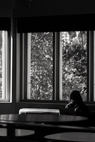 A serene moment of reflection with a team member reviewing data on a laptop in a calm, organized setting.
