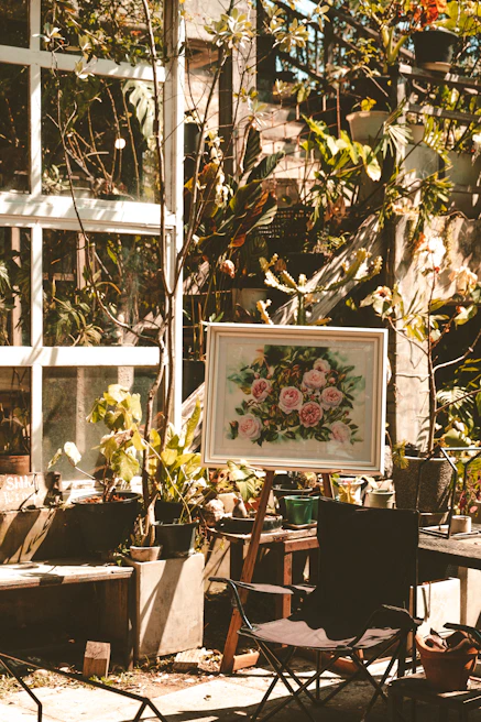 A vibrant garden setup with Dragonhaven gardening tools resting beside blooming flowers under soft sunlight.