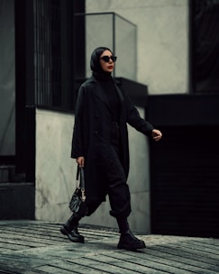 A stylish person holding a sleek crystal bag in a busy urban street, blending modern and elegant vibes.