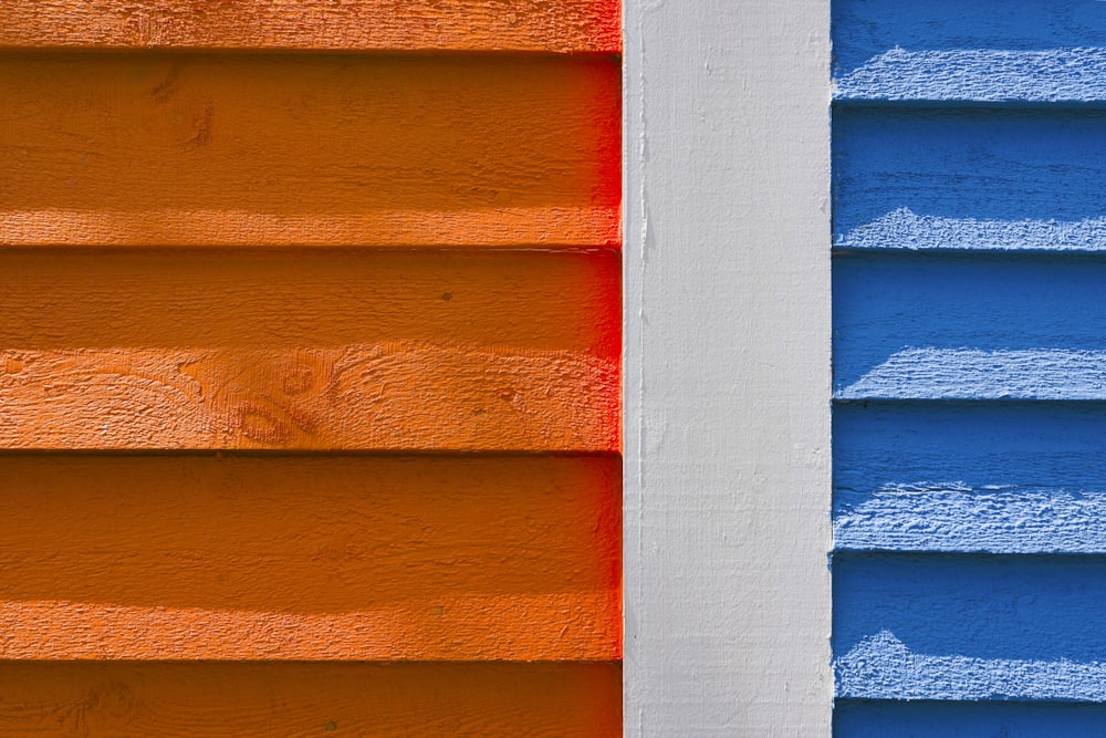 a close up of a blue and orange building