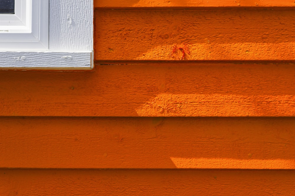 a close up of the side of an orange house