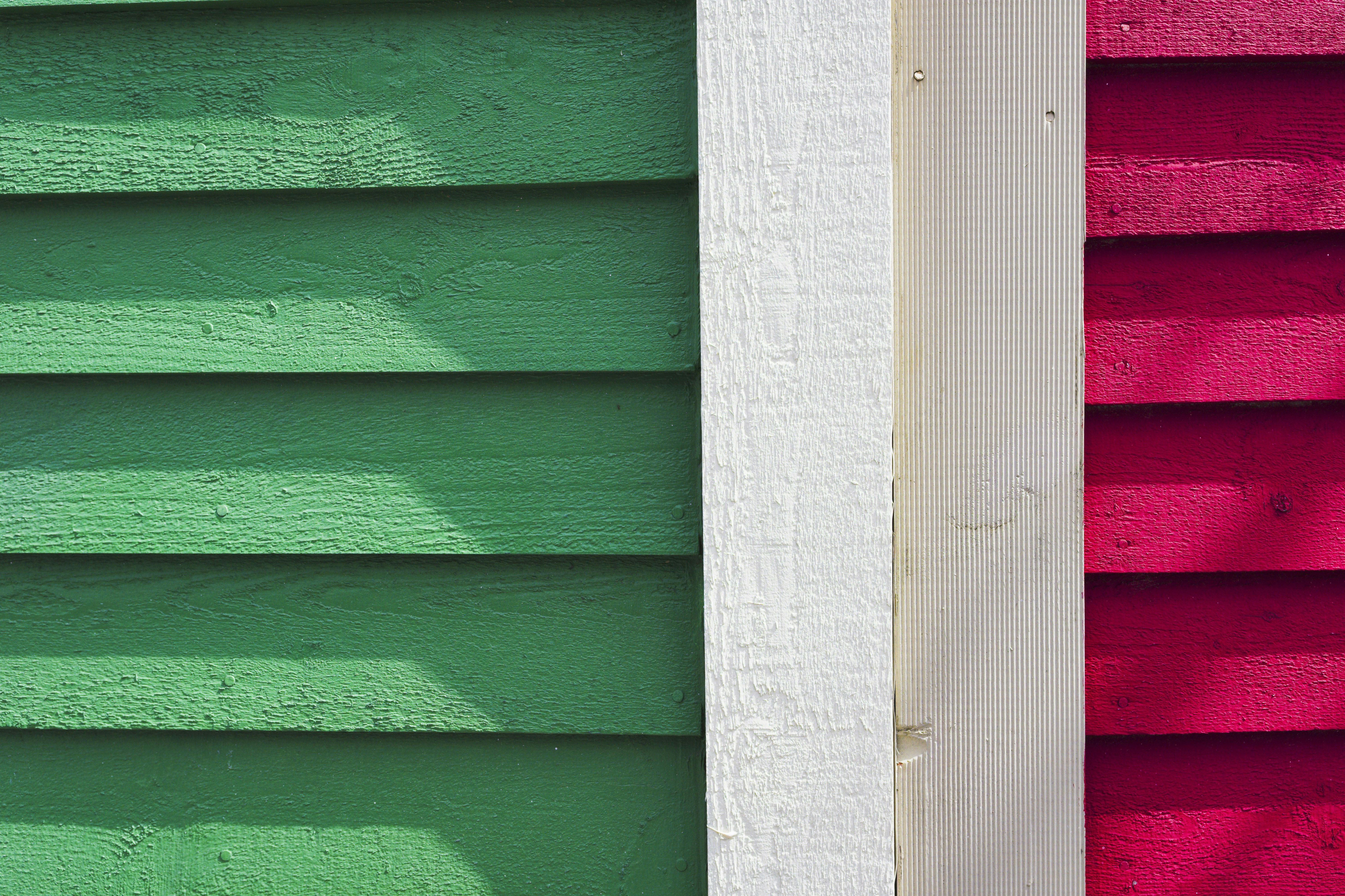 a close up of a red and green building