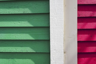 a close up of a red and green building